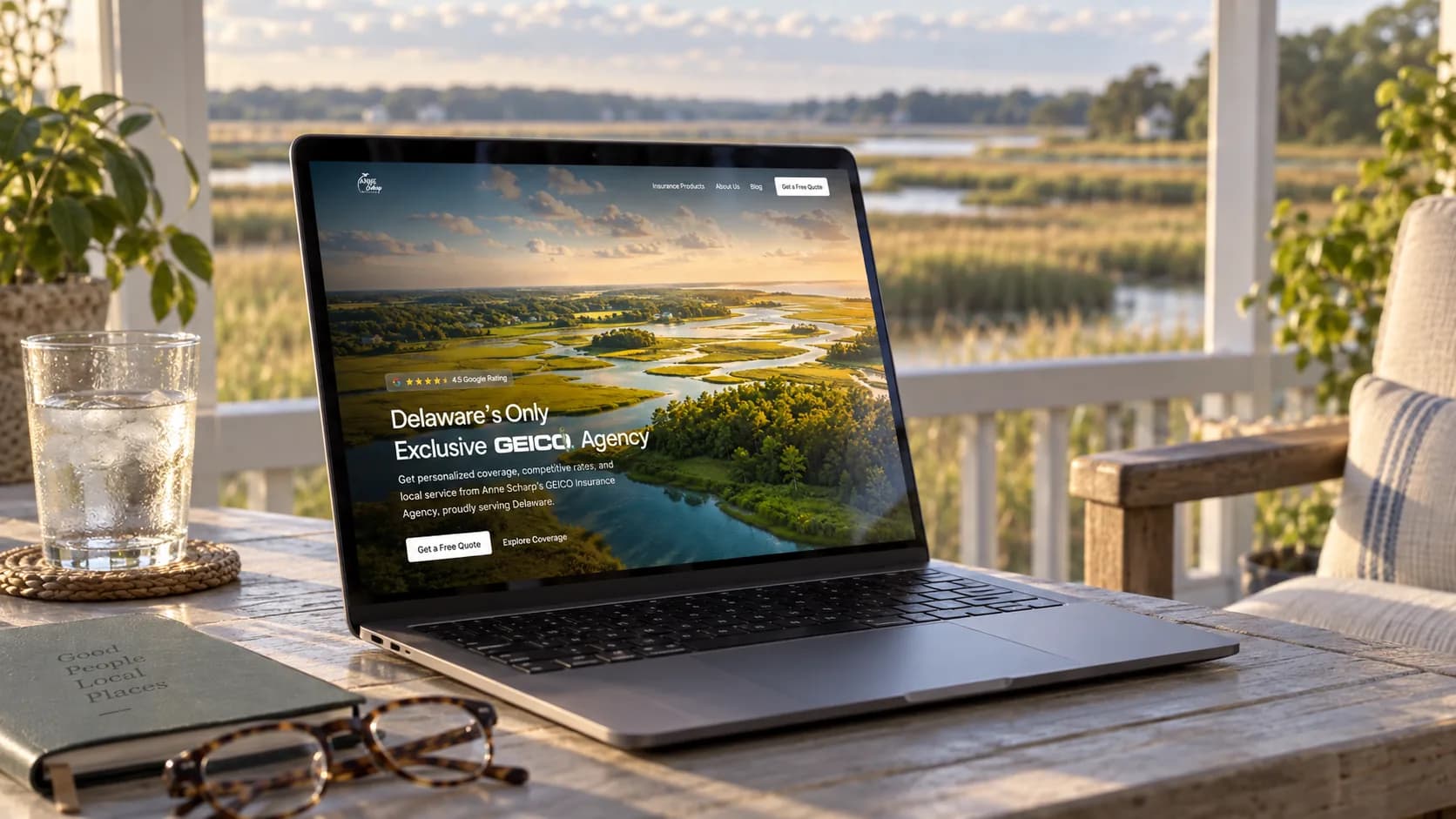 Anne Scharp Insurance homepage shown on a laptop by a Delaware marsh